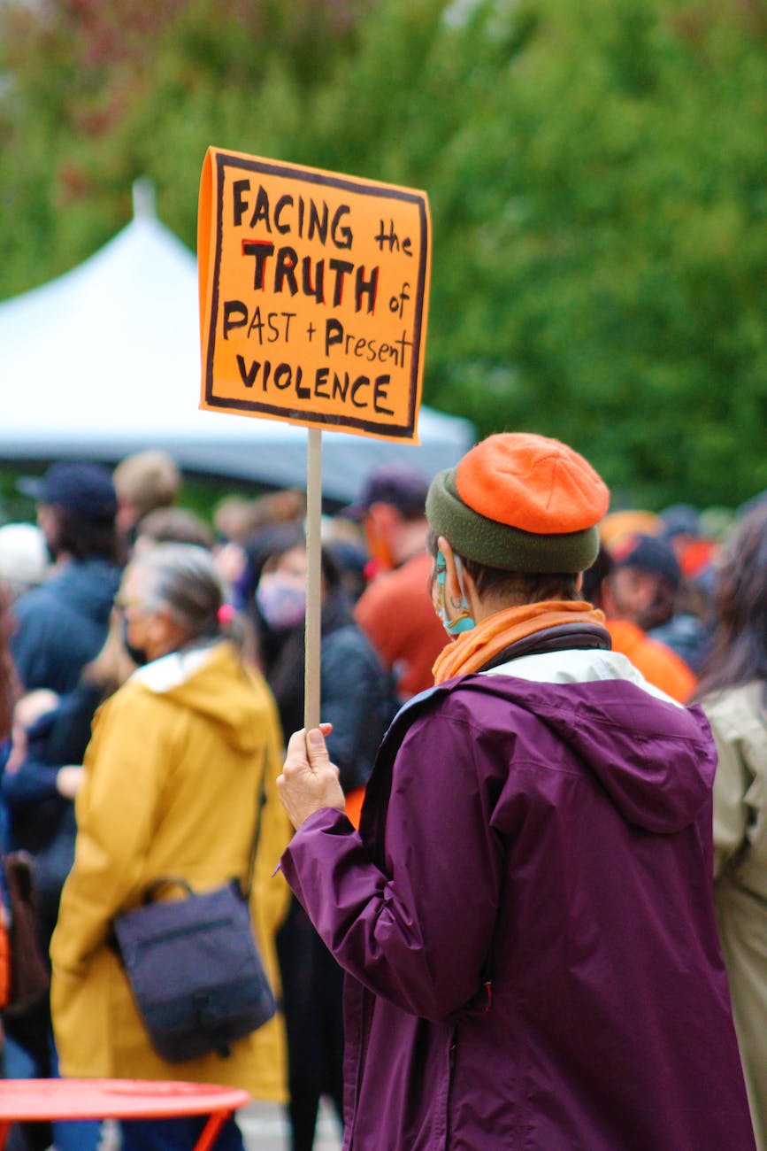 woman holding a sign at a protest