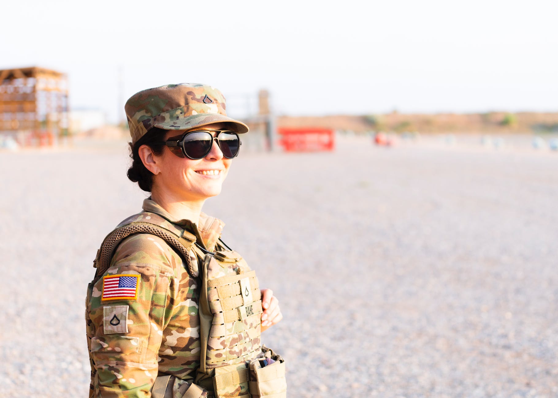 woman in military uniform wearing sunglasses