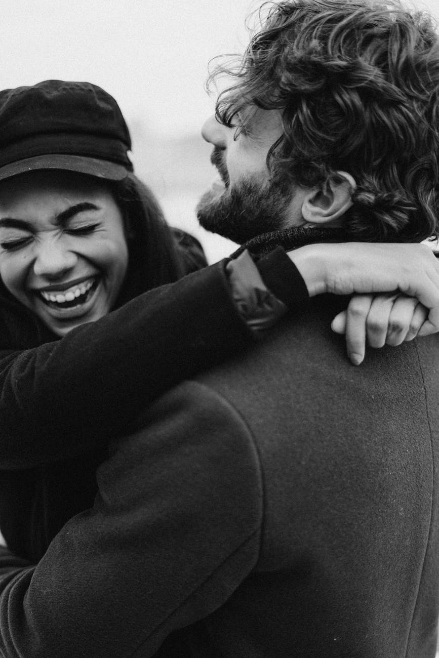 monochrome photo of couple laughing